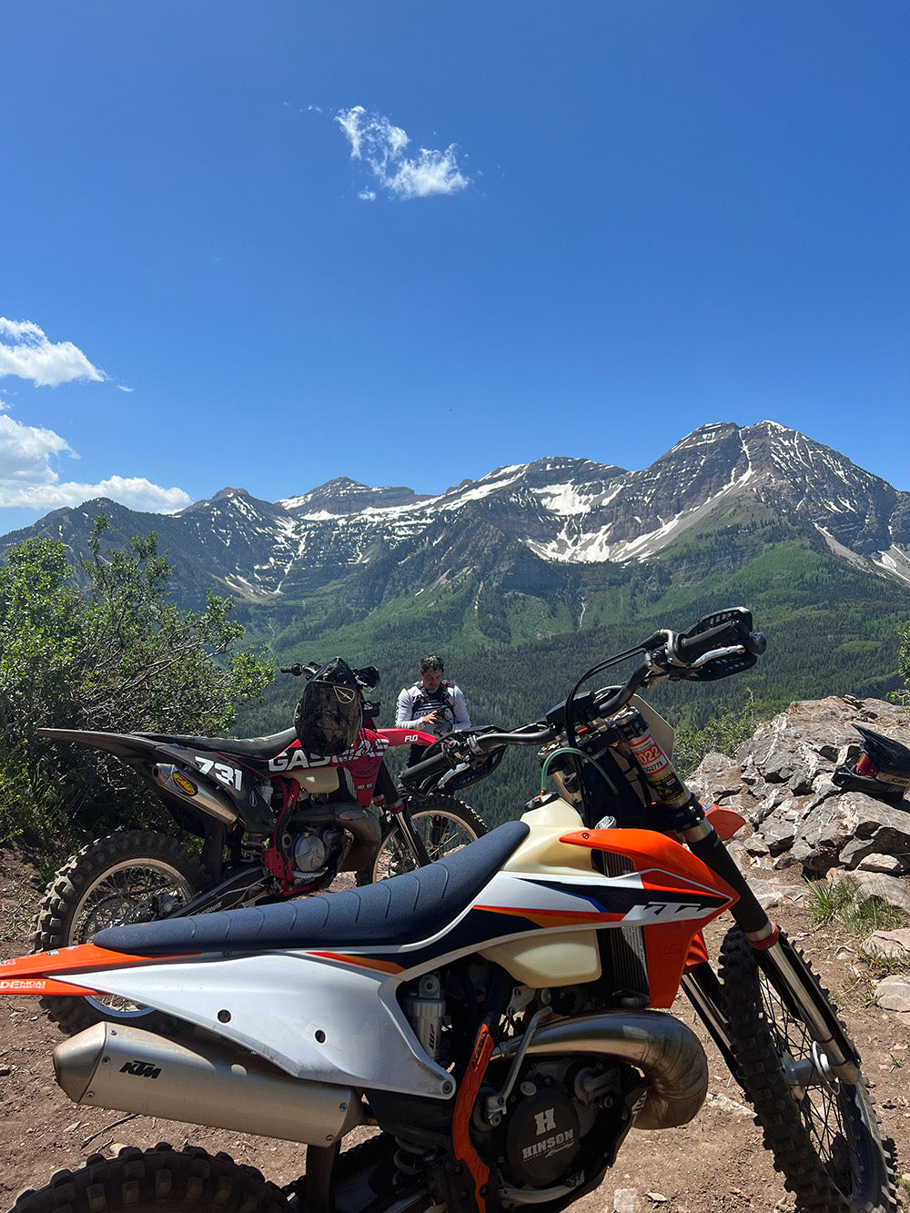 Dirt biker navigating singletrack trail in Northern Utah mountains