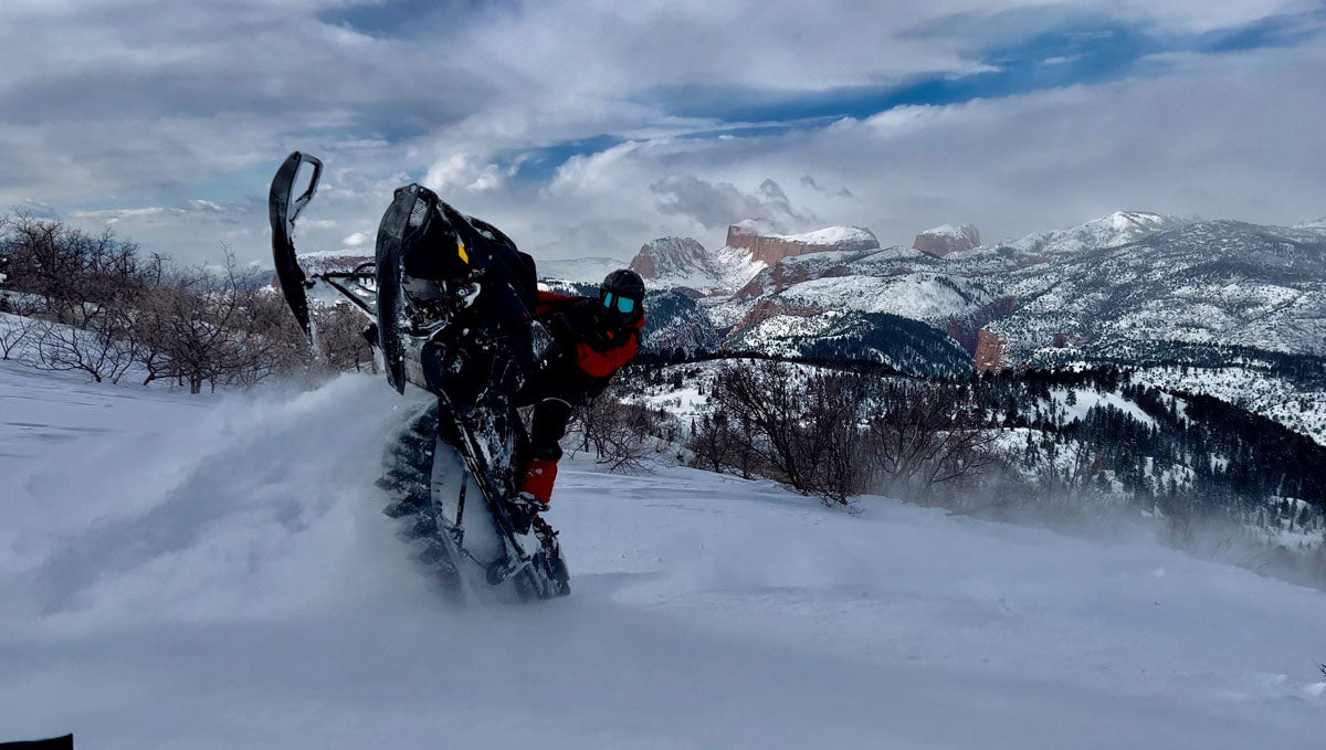 Ski-Doo snowmobile on backcountry trail in Park City, Utah mountains