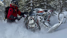 Snowmobile tour group exploring Utah backcountry terrain near Park City