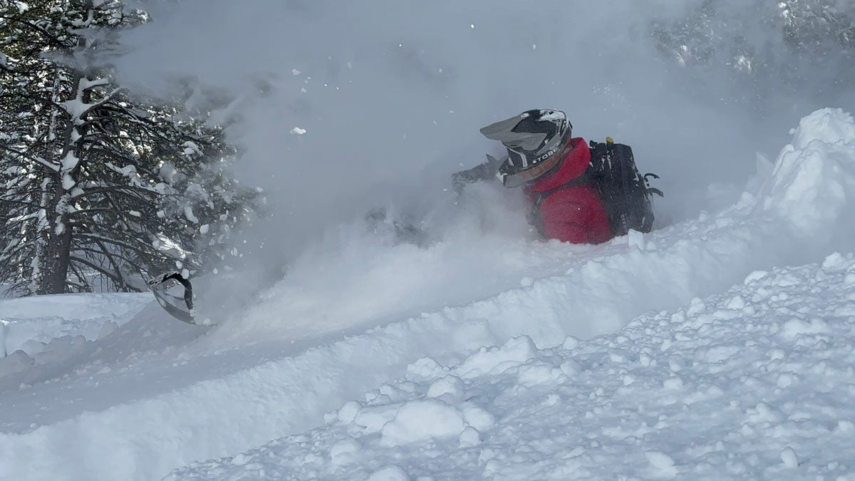 Deep powder snowmobiling in the Utah Wasatch Mountains near Park City