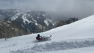 Backcountry snowmobile rider on Utah mountain trail near Park City