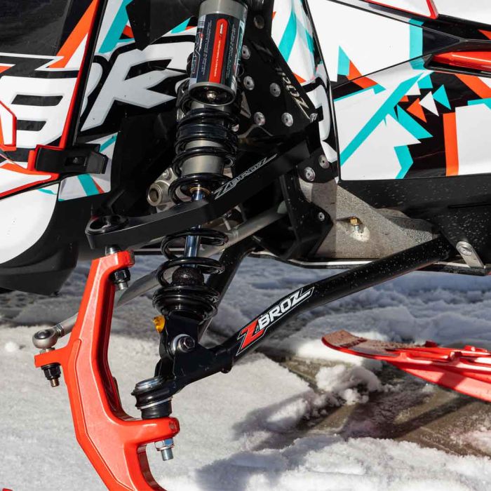 Zbroz A-arm kit installed on Ski-Doo sled — black billet finish
