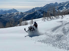 High-performance Ski-Doo snowmobile on Park City Utah backcountry trail