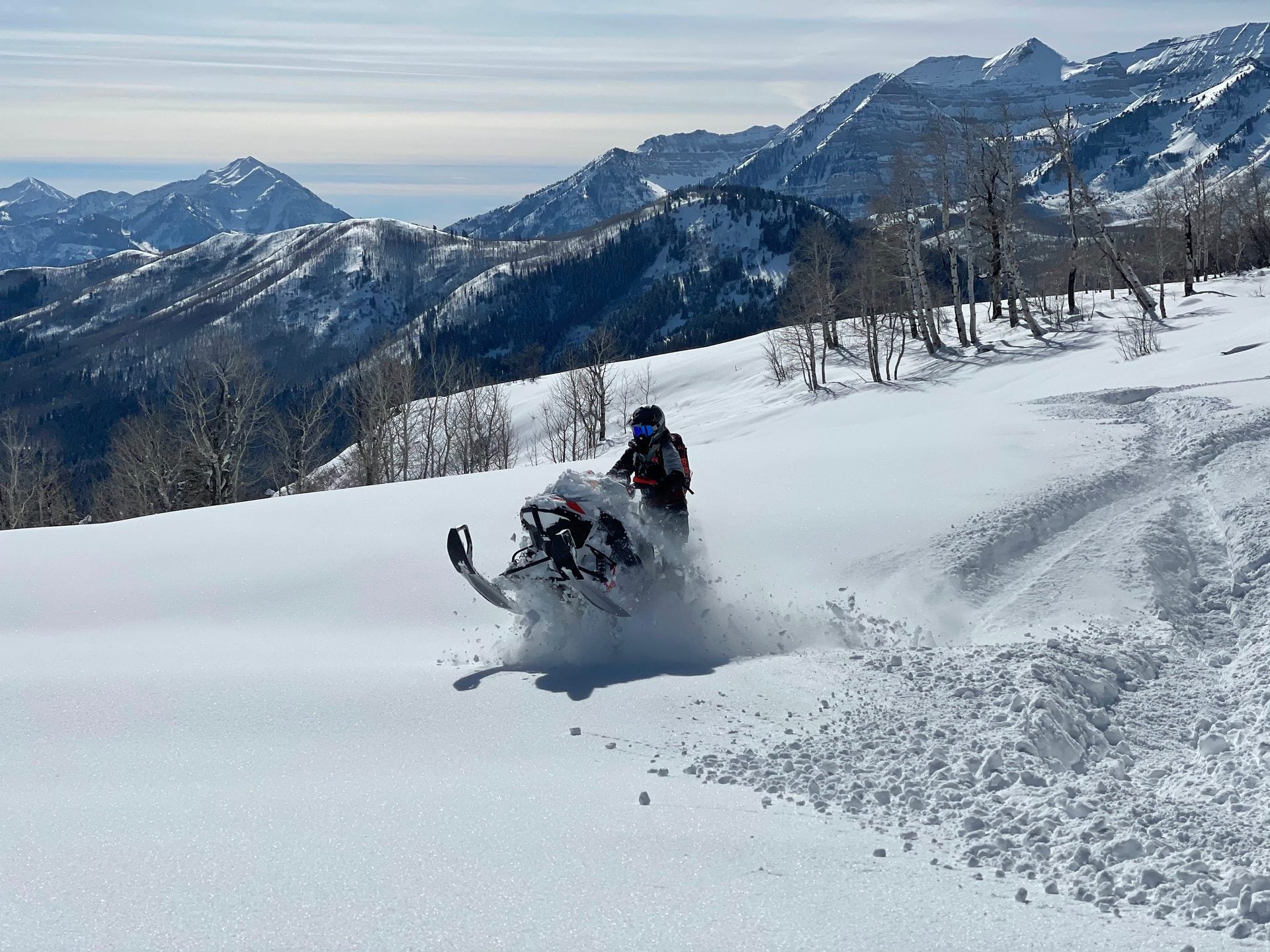 High-performance Ski-Doo snowmobile on Park City Utah backcountry trail