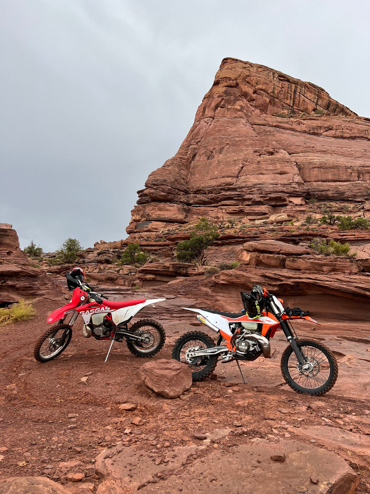 Moab dirt bike vacation — rider on red rock trail