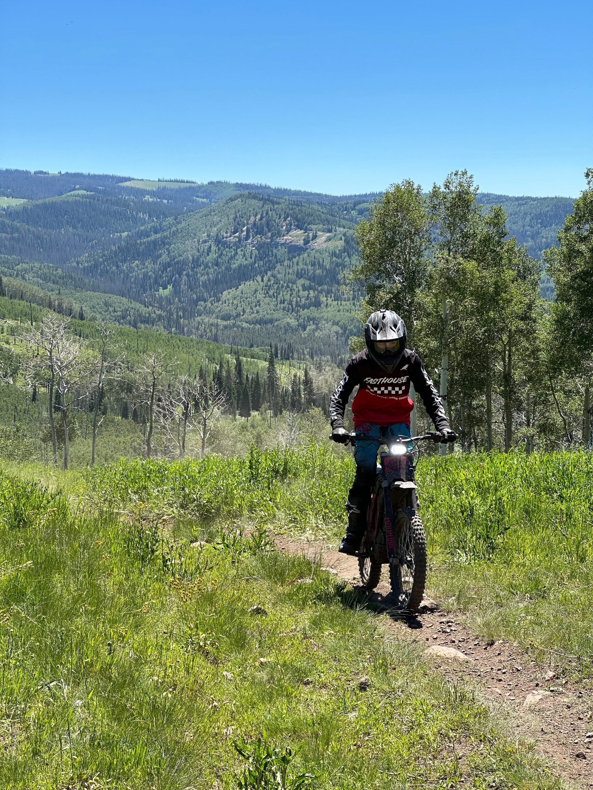 Electric dirt bike tour Utah — rider on scenic mountain trail